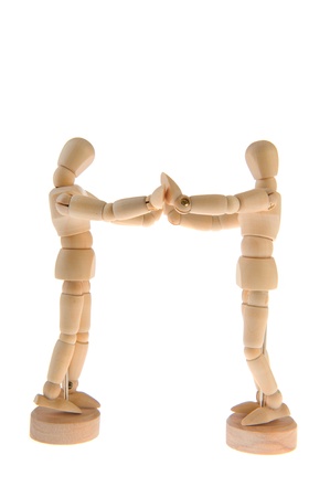 Wooden dolls together in love isolated over white backgroundの写真素材