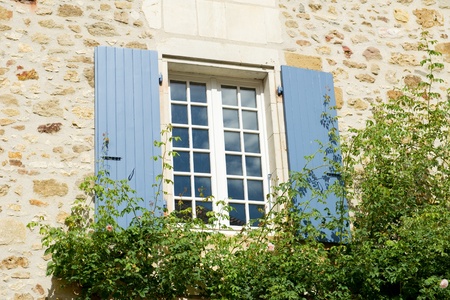 French window with typical blue shutters