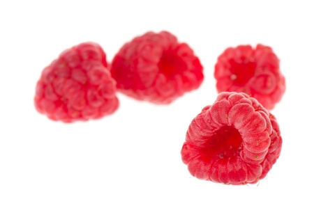 Fresh raspberries isolated over white background