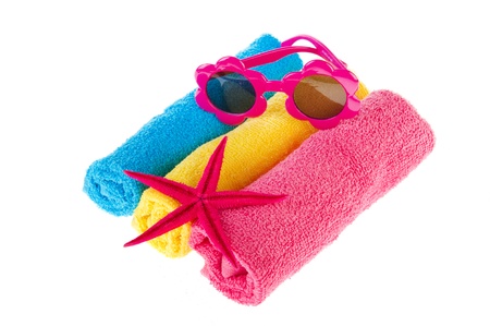 Three rolled towels in blue yellow and pinkの写真素材