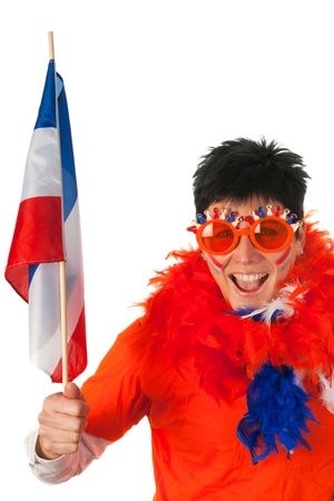 Dutch woman dressed in orange with Holland flag as a soccer fanの写真素材
