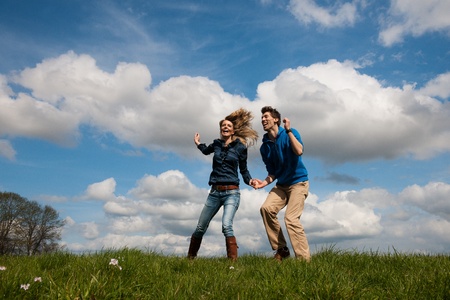 Happy young couple outdoor in the fieldsの写真素材
