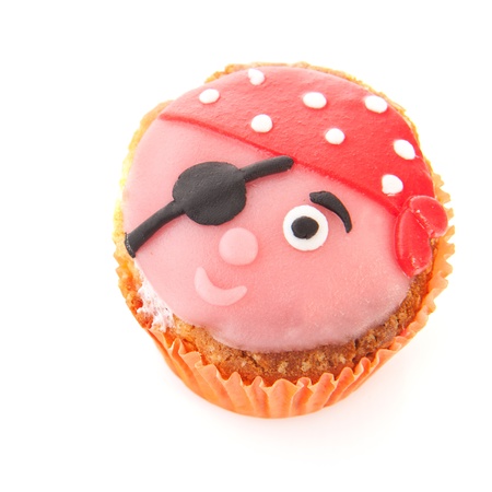 Funny pirate cupcake isolated over white backgroundの写真素材