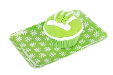 Green cup cake on plate for St. Patricks dayの写真素材