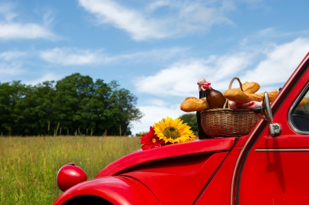 Typical French car with bread and wine for picnicの写真素材