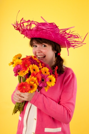 Young woman is happy with her flowersの写真素材
