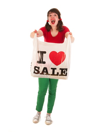 Young woman is loving sales while shoppingの写真素材