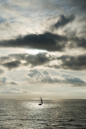 Sailing at the sea in the very early morningの写真素材