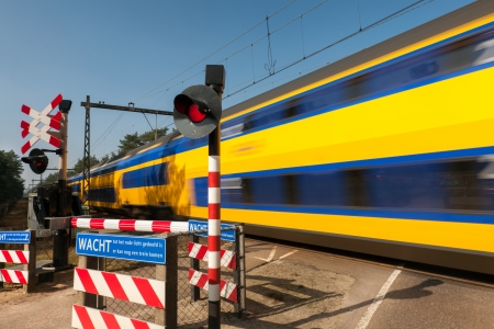 Dutch yellow and blue train is passing byの写真素材