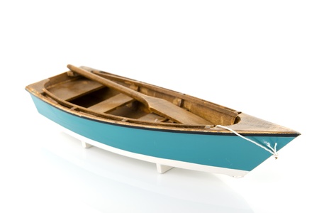 Blue rowing boat isolated over white backgroundの写真素材