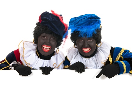 Dutch characters as black petes for typical Sinterklaas holidays with white boardの写真素材