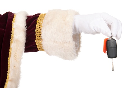 Santa Claus is giving an expensive present as a carの写真素材