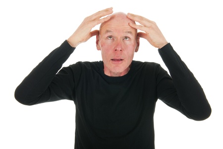 Man is looking to his bald head