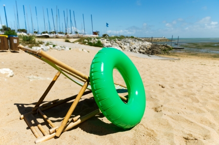 empty beach chair with inflatable toy at island d'Oleronの写真素材