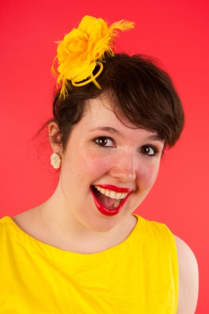 Colorful portrait of a funny girl in red and yellowの写真素材