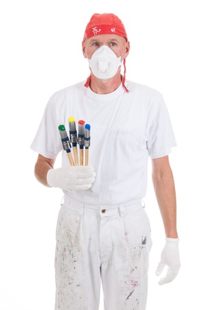 Painter with colorful paint brushes and safety mask for filtering の写真素材