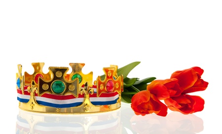 Dutch golden crown with flag colors and tulips for the king isolated over white backgroundの写真素材