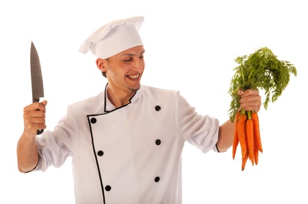 Cook preparing fresh carrots isolated over white backgroundの写真素材