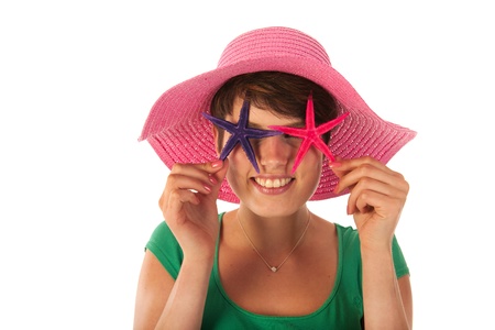 Summer girl with starfishes at the beachの写真素材