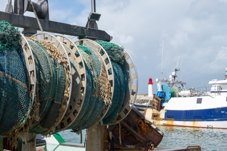 Fishing boat with nets in La Cotiniere at island d'Oleron in Franceの写真素材