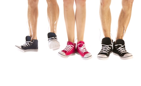 Feet in basketball shoes isolated over white backgroundの写真素材