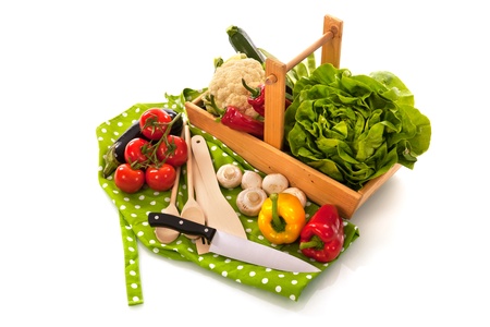 cooking with assortment vegetables in harvest basketの写真素材
