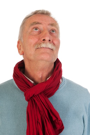 Older man looking up in studioの写真素材