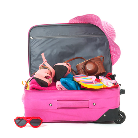 Packing the pink suitcase for the summer vacation Packing the pink suitcase for the summer vacation