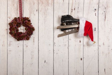 Christmas wreath hanging on wooden wall with copy spaceの写真素材