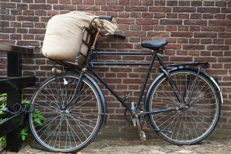 Bicycle from the miller with jute bag flourの写真素材