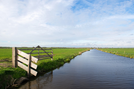 Landscape with fench and ditch in dutch polder Arkemheenの写真素材