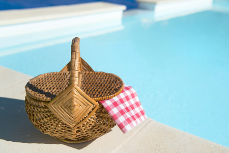 picnic basket at the swimming poolの写真素材