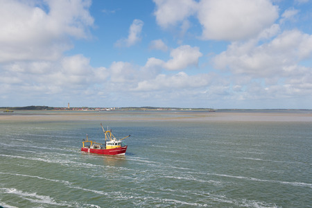 Red Dutch fishing trawler at wadden sea