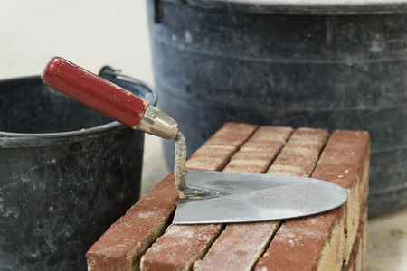Trowel and bricks to build a house or a wallの写真素材