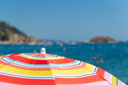 Beach and sea with parasolsの写真素材
