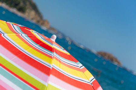 Beach and sea with parasolsの写真素材