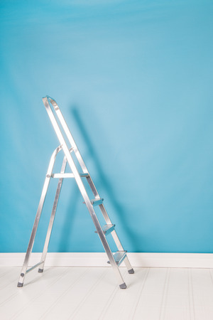 step ladder in blue interiorの写真素材