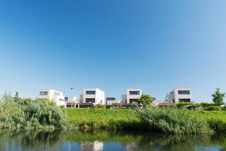 Modern houses in Holland near the riverの写真素材