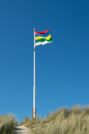 Flag in the wind on Dutch wadden island Terschellingの写真素材