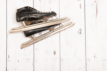 Old Dutch skates hanging at the wooden wallの写真素材