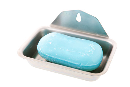 Soap bar in metal tray isolated over white backgroundの写真素材