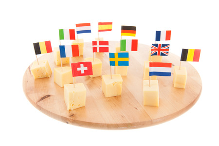 Tray with European cheese cubes with flagsの写真素材