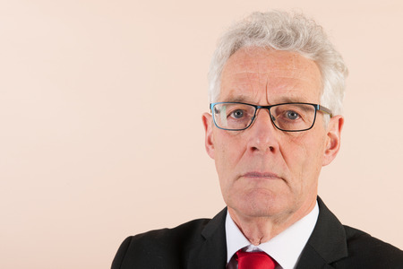 Senior man with glasses and formal wearの写真素材