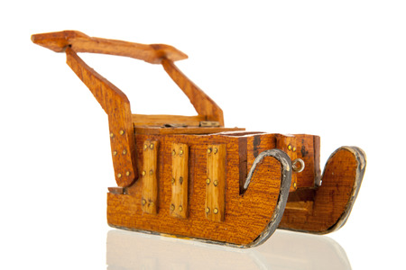 Wooden sledge isolated over white backgroundの写真素材