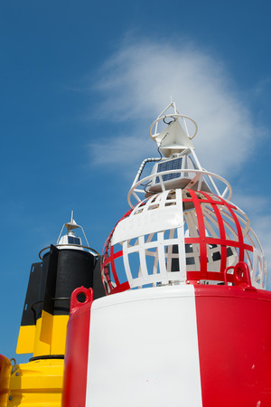 Colorful buoys for navigation in the seaの写真素材