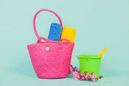 Summer vacation for family with beach bag towels and toysの写真素材