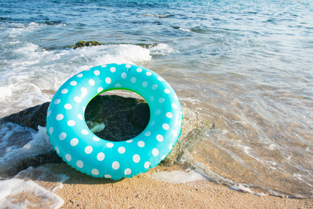 Landscape Spanish Costa Brava beach with inflatable toysの写真素材