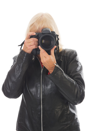 Female photographer with big cameraの写真素材