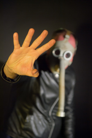 man with mask in the darkの写真素材