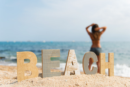 vintage wooden letters with word at the beachの写真素材